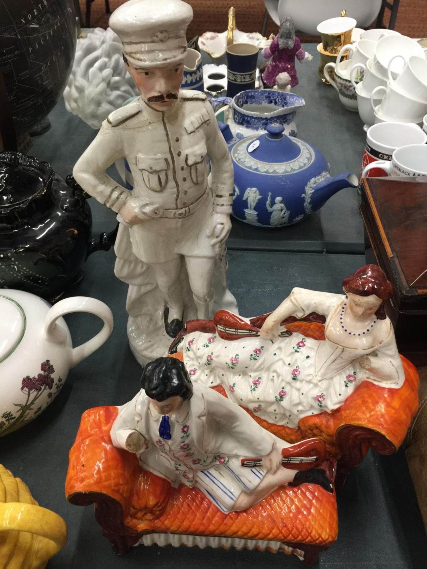 A LARGE VICTORIAN STAFFORDSHIRE LORD KITCHENER AND A PAIR OF FIGURES ON CHAISE LONGUES - BOTH A/F