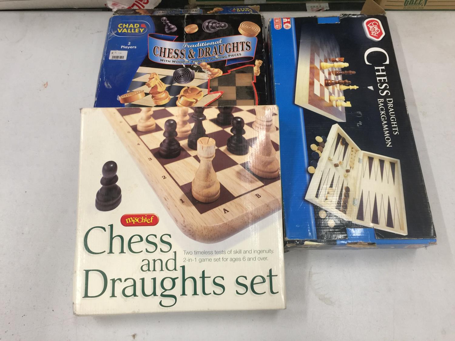 THREE BOXED GAMES, TWO CHESS AND DRAUGHTS, ONE CHESS, DRAUGHTS AND BACKGAMMON