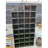 A VINTAGE METAL 32 SECTION PIGEON HOLE STORAGE UNIT