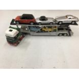 A MODEL CAR TRANSPORTER WITH FIVE ASSORTED CARS ON BOARD TO INCLUDE A MERCEDES 300SL