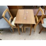 A FORMICA TOP DROP-LEAF KITCHEN TABLE AND TWO CHAIRS