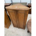 A GEORGE III OAK TWO DOOR CORNER CUPBOARD, 29" WIDE