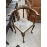 AN EDWARDIAN MAHOGANY AND INLAID CORNER CHAIR ON CABRIOLE LEGS