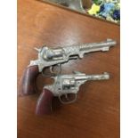 TWO VINTAGE TOY COWBOY GUNS