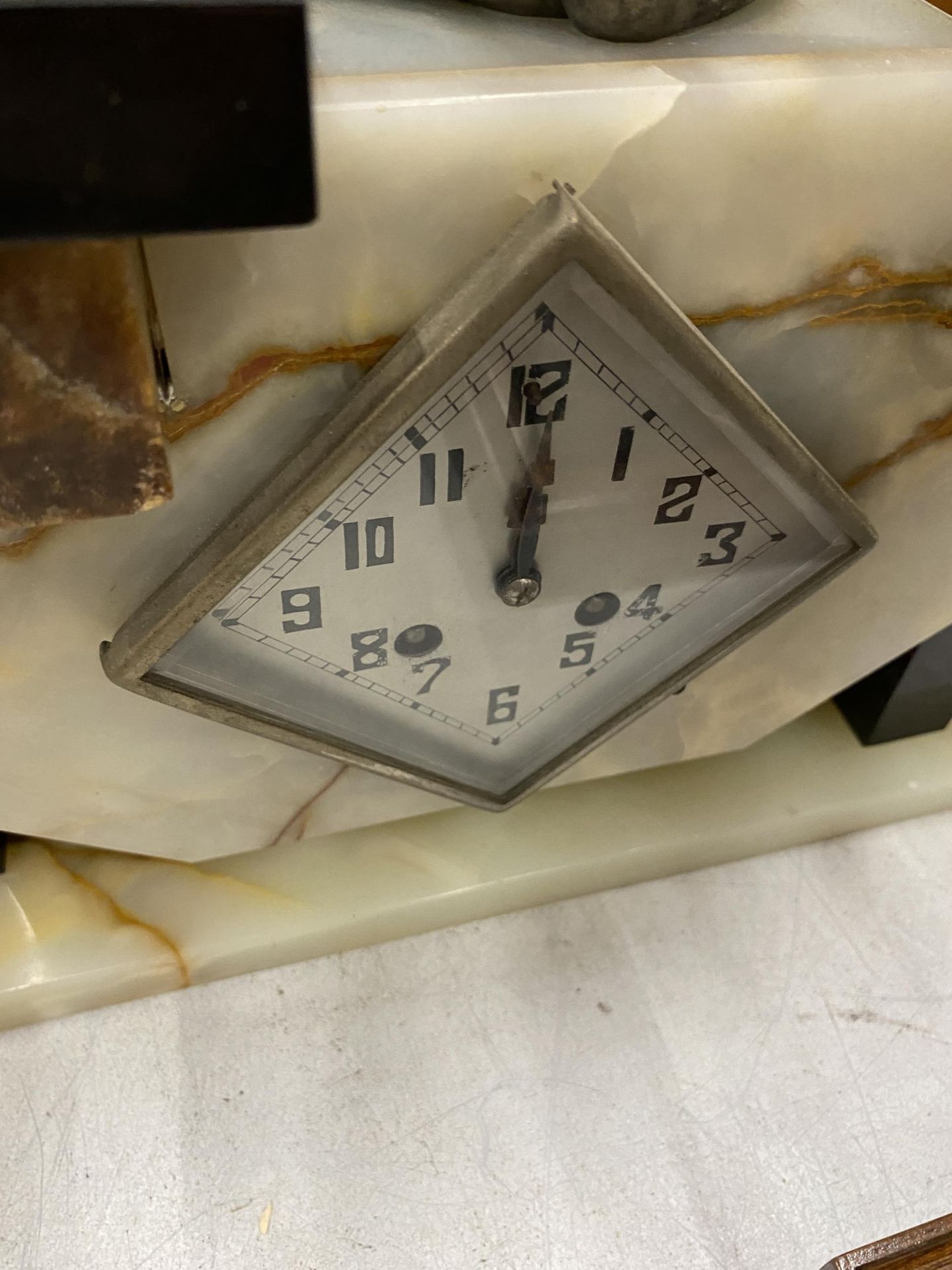 AN ART DECO MANTLE CLOCK WITH GIRL WITH BIRD FINIAL DESIGN AND SIDE GARNITURES - Image 2 of 3