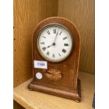 A MAHOGANY DOME TOPPED MANTLE CLOCK