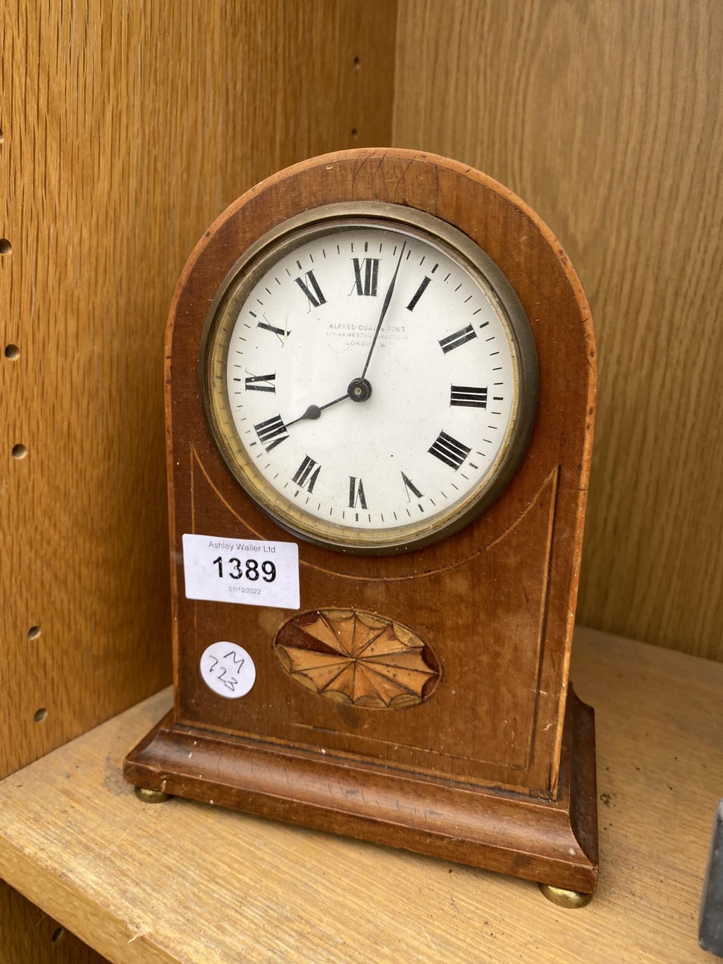 A MAHOGANY DOME TOPPED MANTLE CLOCK