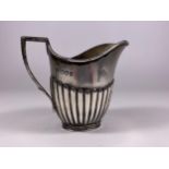 A LONDON HALLMARKED SILVER CREAM JUG