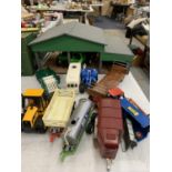 A WOODEN FARM BARN WITH VARIOUS FARM RELATED VEHICLES AND IMPLEMENTS