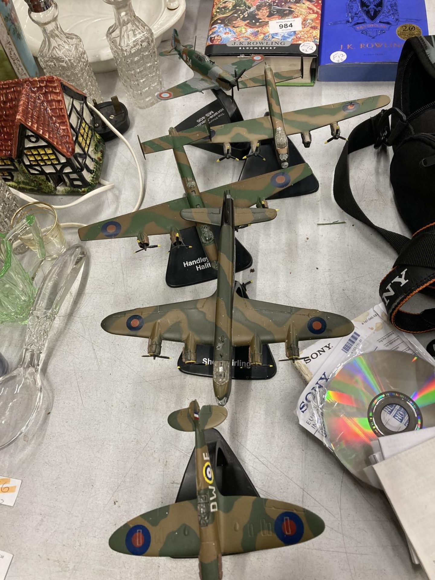 FIVE FIGHTER PLANES ON PLINTHS TO INCLUDE SPITFIRE, HALIFAX, AVRO LANCASTER, ETC