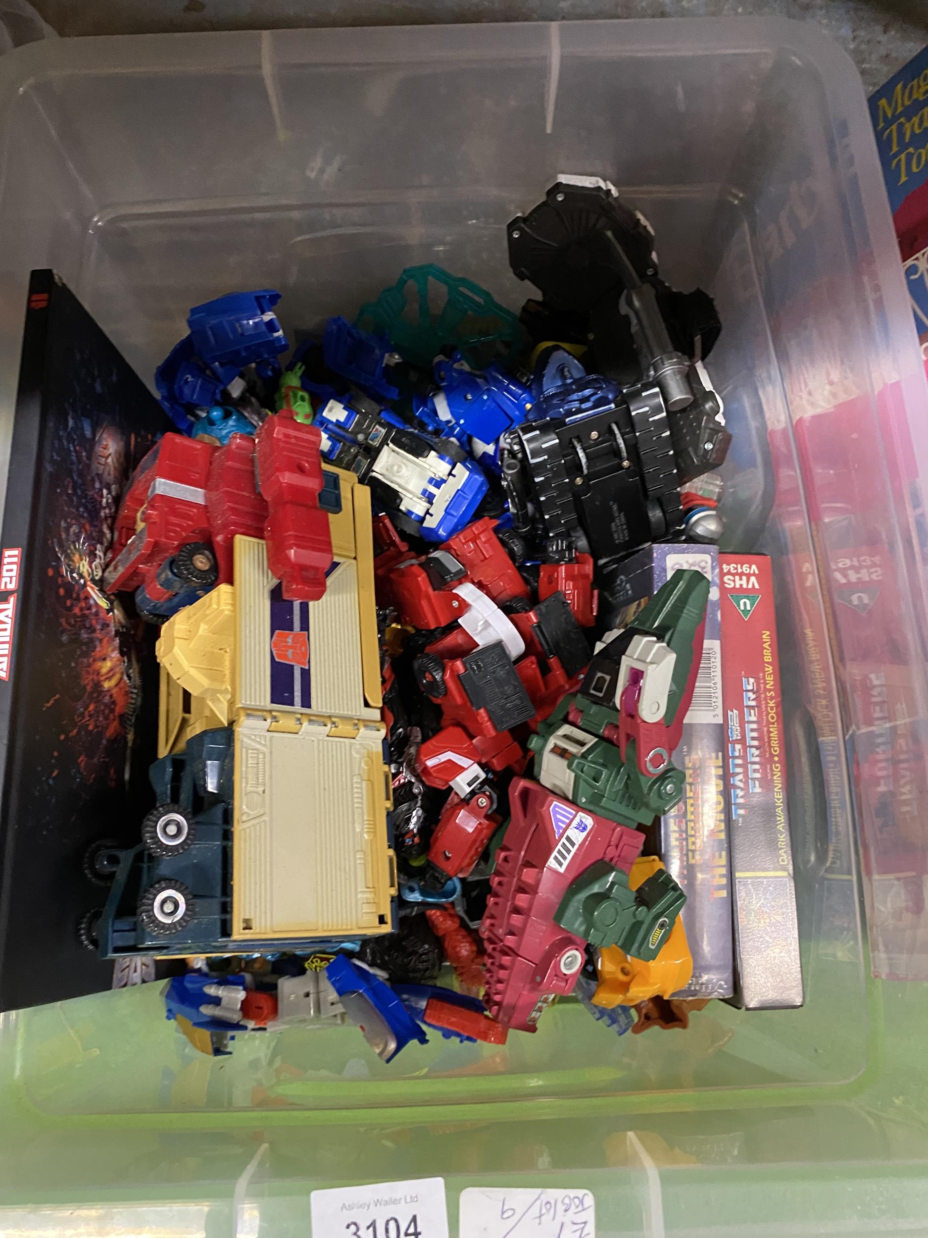 A MIXED BOX OF TRANSFORMERS MODELS WITH BOOKS, FIGURES ETC