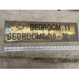A BRASS 'BEDROOM 11 AND BEDROOMS 18-32' SIGN (L:54CM)