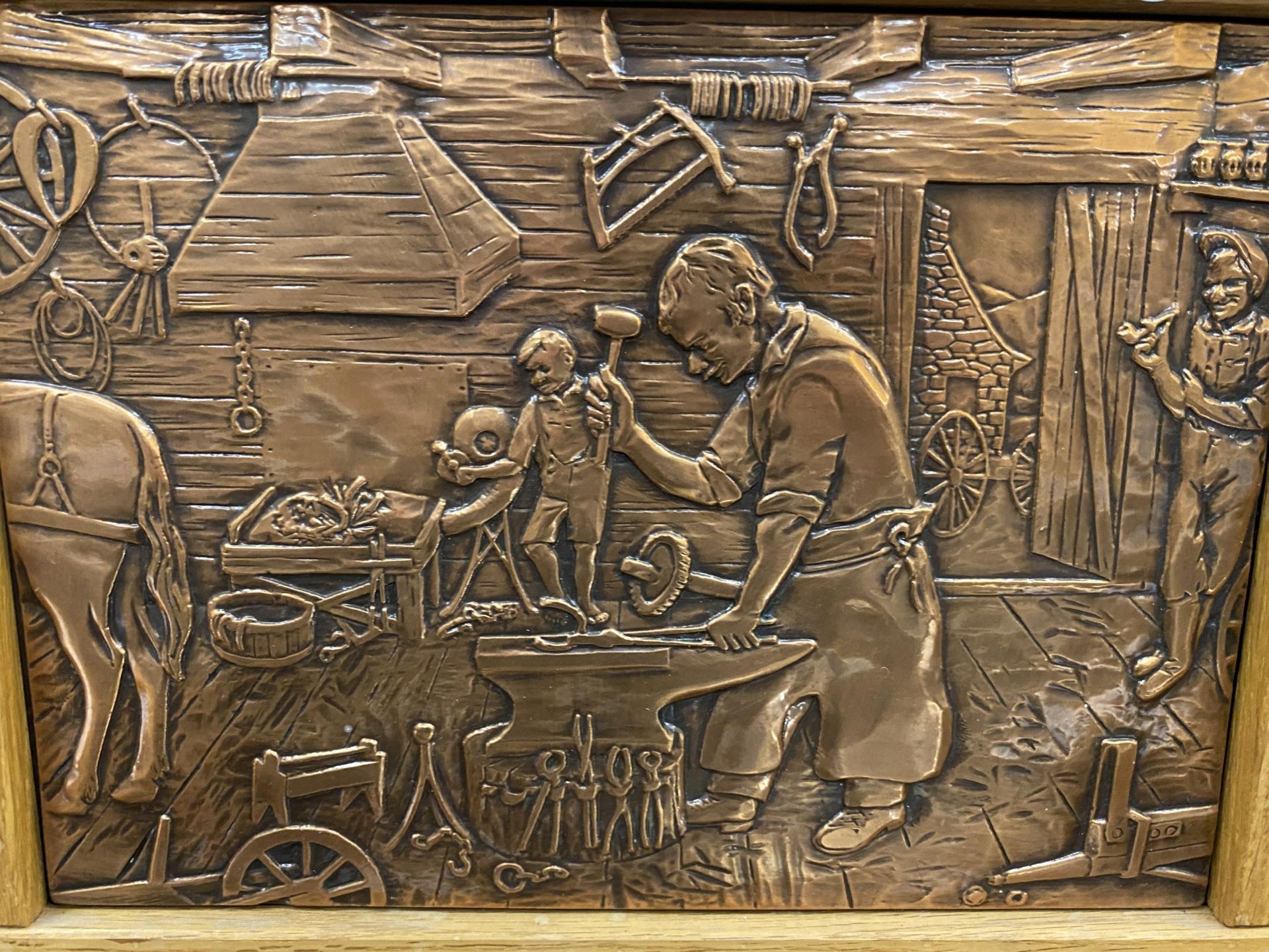 A WOODEN FRAMED COPPER PLAQUE OF A BLACKSMITH - Image 2 of 3