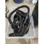 A LENGTH OF THICK BLACK ROPE