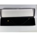 A 9CT YELLOW GOLD HEART PENDANT NECKLACE ON BLACK CORD STRING, BOXED