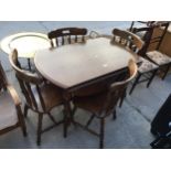 A MODERN OVAL DROP-LEAF DINING TABLE AND FOUR CHAIRS