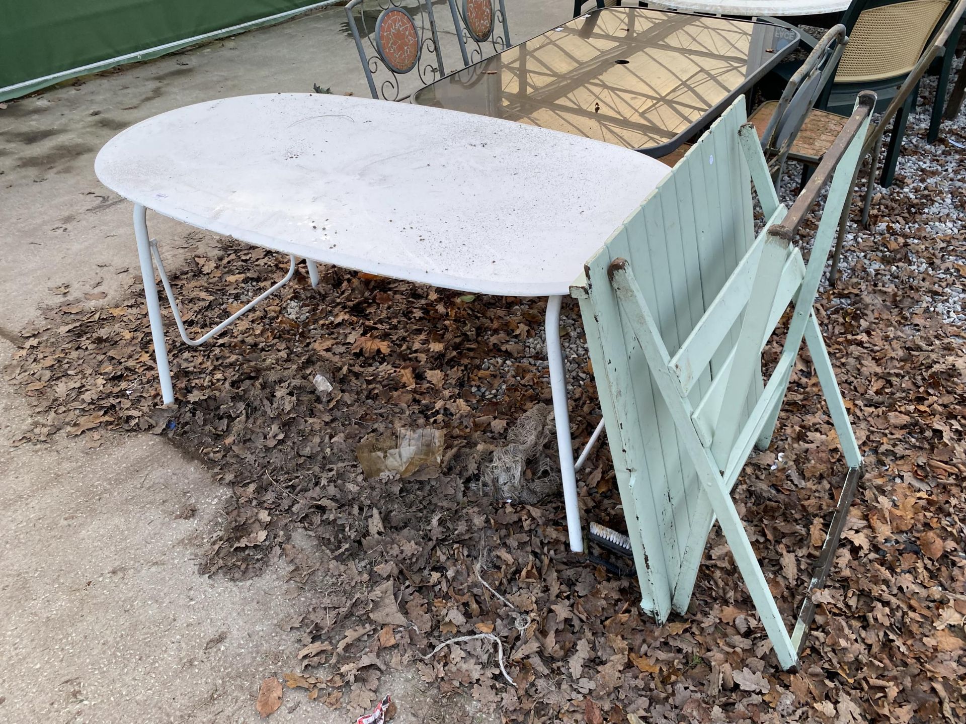 A LARGE WOODEN TOPPED TABLE AND A FOLDING WOODEN GARDEN TABLE