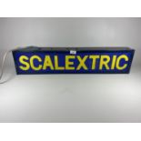 AN ILLUMINATED SCALEXTRIC SIGN (WIDTH 80.5CM, HEIGHT 18CM, DEPTH 10CM)