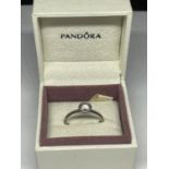 A PANDORA SILVER RING IN A PRESENTATION BOX