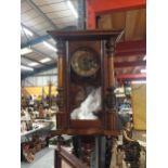 A MAHOGANY FRAMED VINTAGE STYLE WALL CLOCK WITH PENDULUM AND KEY
