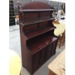 A 19TH CENTURY WALNUT AESTHETIC MOVEMENT DRESSER WITH PANELLED DOORS TO THE BASE, THE UPPER