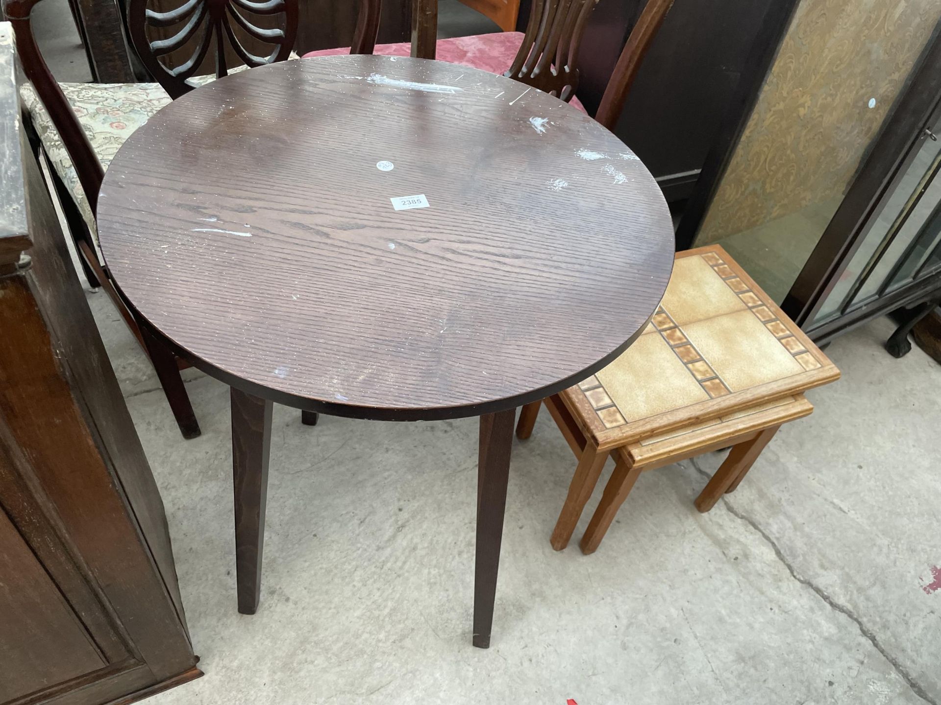 A PUB TABLE AND NEST OF TWO TABLES