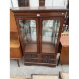 A MODERN TWO DOOR GLAZED BOOKCASE WITH TWO DRAWERS TO THE BASE, 32" WIDE