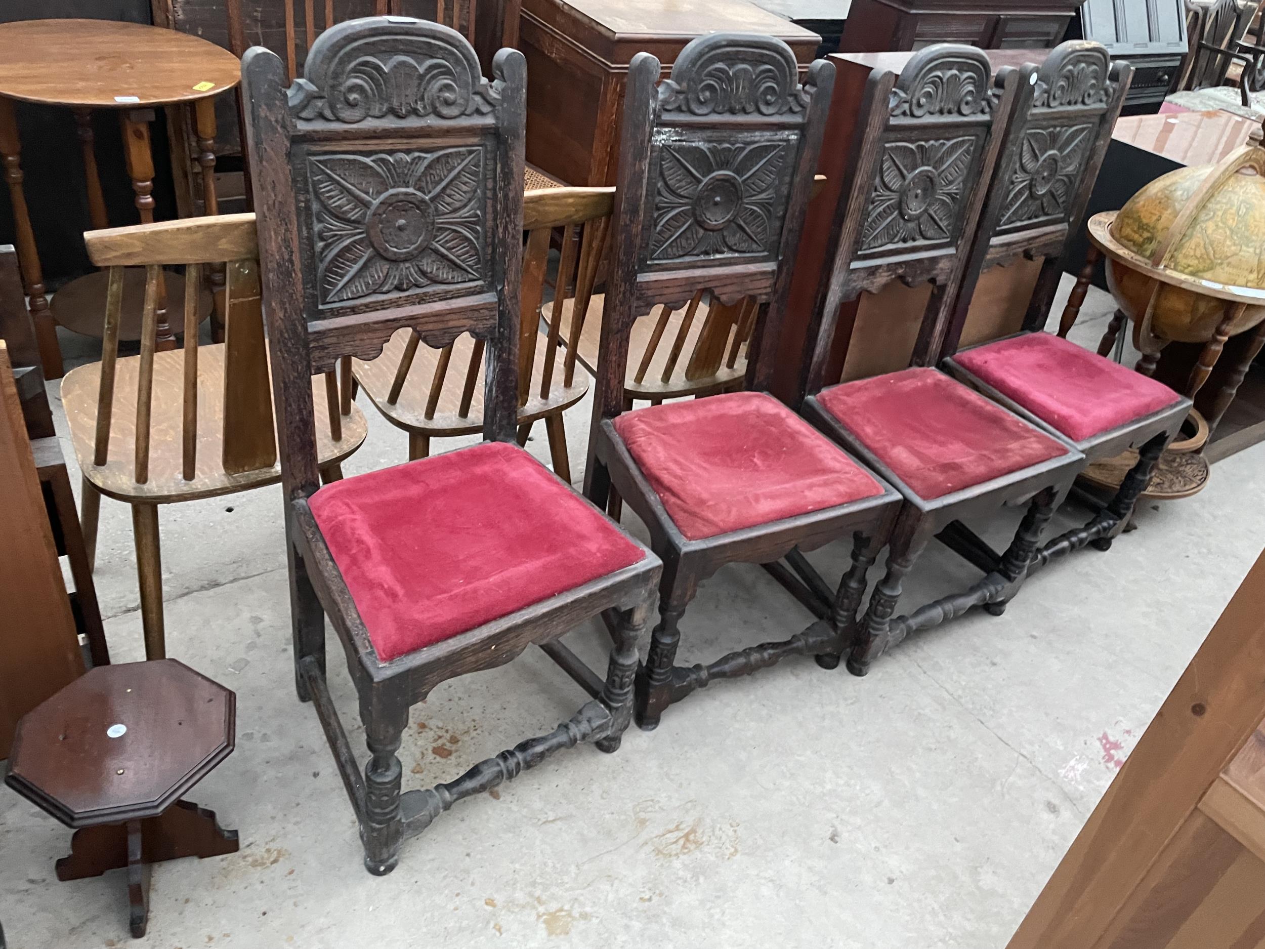 A SET OF FOUR OAK JACOBEAN STYLE DINING CHAIRS WITH CARVED BACK PANEL, TURNED FRONT LEGS AND