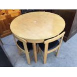 A MODERN DINING TABLE, 41.5" DIAMETER AND FOUR MATCHING DINNG CHAIRS