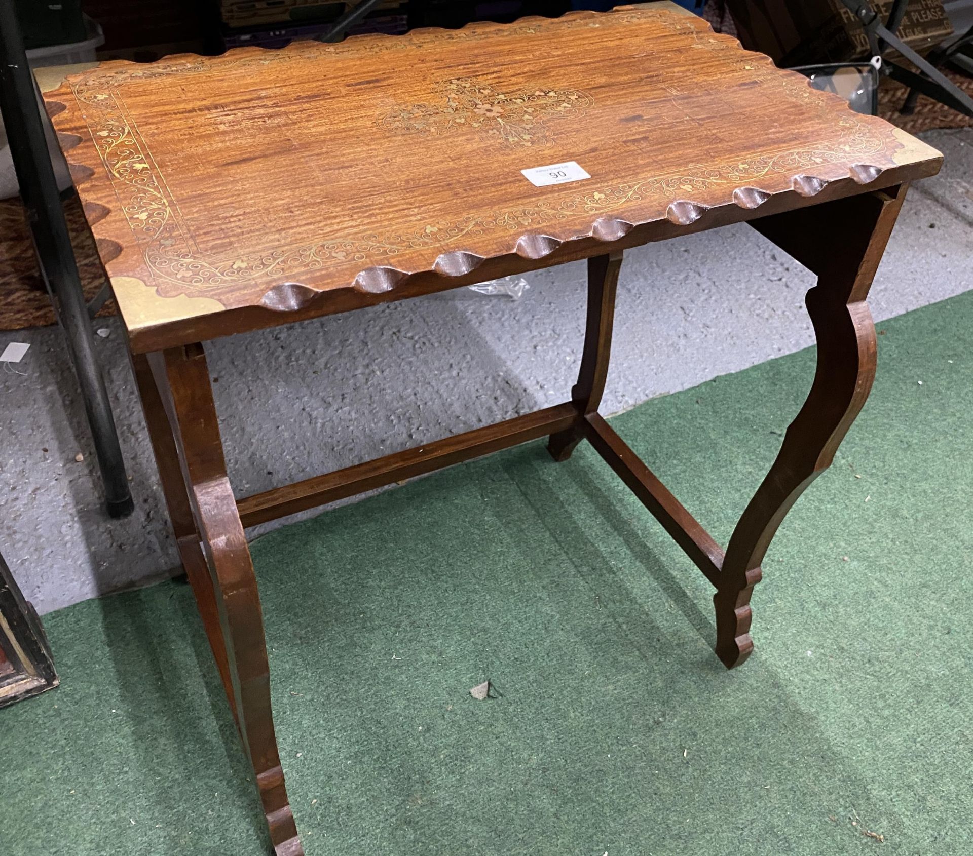 A BRASS INLAID WOODEN SIDE TABLE