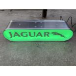 A JAGUAR ILLUMINATED LIGHT BOX SIGN - WORKING ORDER AT TIME OF CATALOGUING. WIDTH 44CM, HEIGHT 10.
