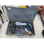 A BOSCH ELECTRIC SDS DRILL AND CARRY CASE