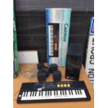 A CASIO CASIOTONE MT-220 KEYBOARD AND A LG SPEAKER SYSTEM