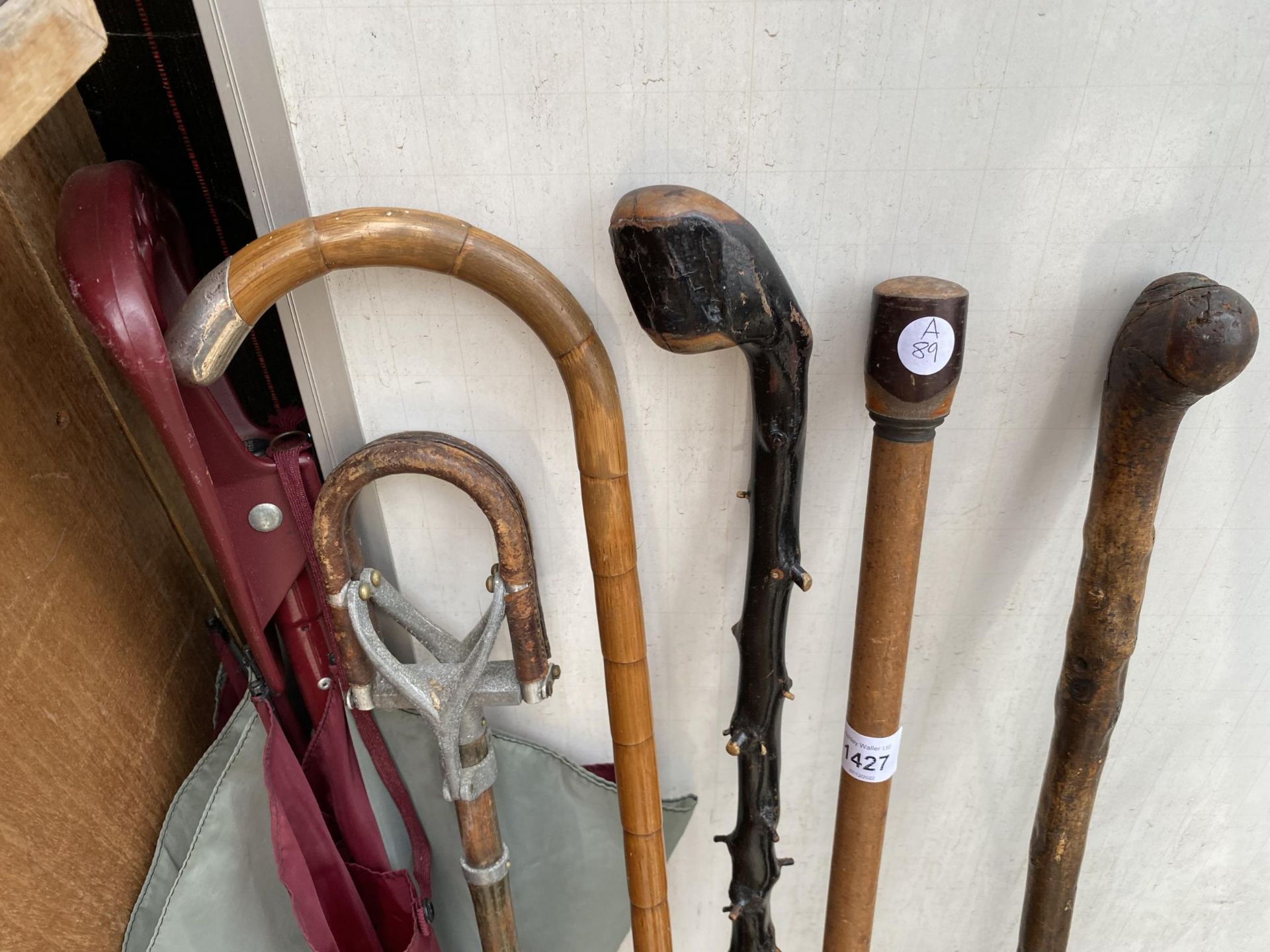 FOUR VARIOUS WALKING STICKS, ONE WITH A HALLMARKED SILVER HANDLE, A STICK SEAT AND AN UMBRELLA - Image 2 of 2