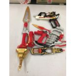 A QUANTITY OF POWER RANGER WEAPONS AND ACCESSORIES TO INCLUDE A PHONE, GUN, SWORDS, ETC