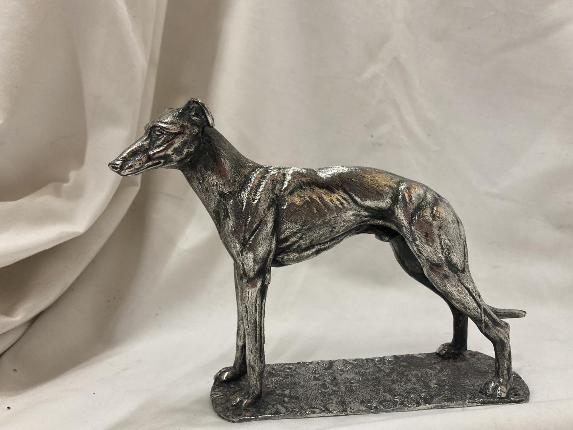 A SILVER CHROMED FIGURE OF A STANDING GREYHOUND HEIGHT 14CM