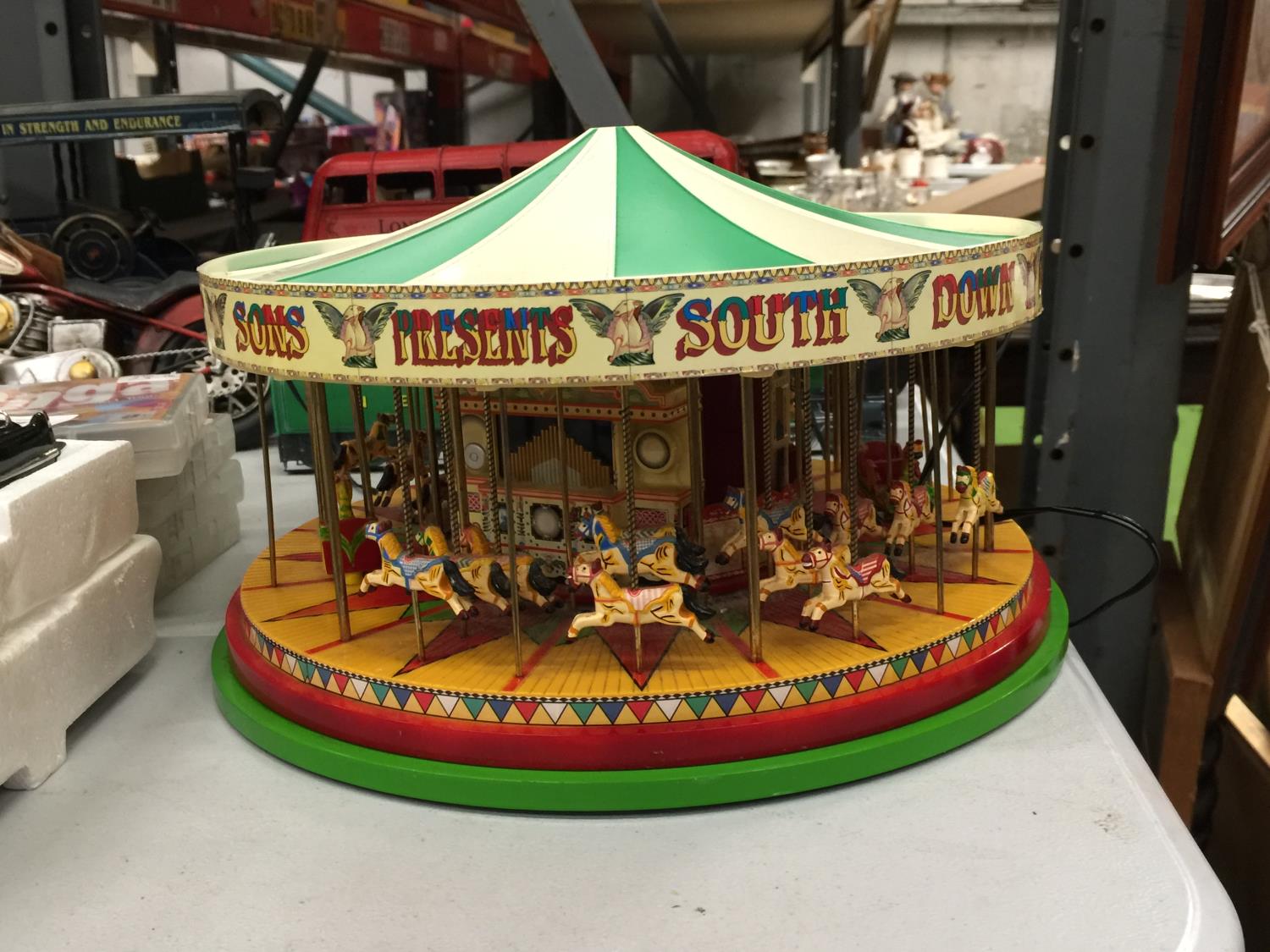 AN ELECTRIC MODEL CIRCUS MERRY GO ROUND