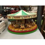 AN ELECTRIC MODEL CIRCUS MERRY GO ROUND