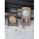 A WALL CLOCK AND A VINTAGE WOODEN CASED MANTEL CLOCK