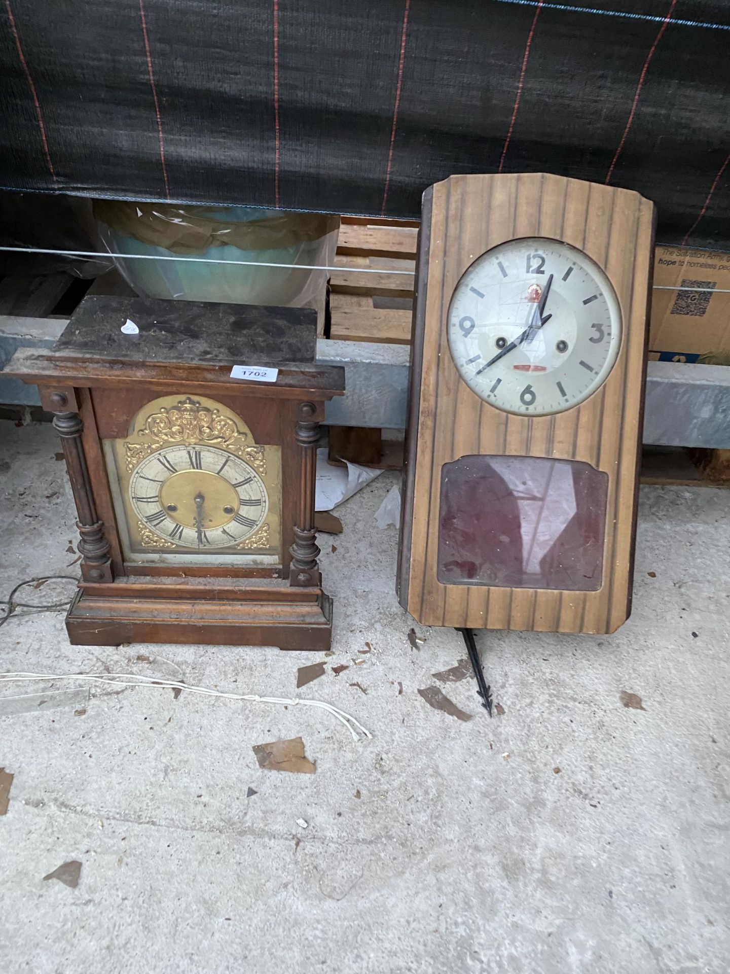 A WALL CLOCK AND A VINTAGE WOODEN CASED MANTEL CLOCK
