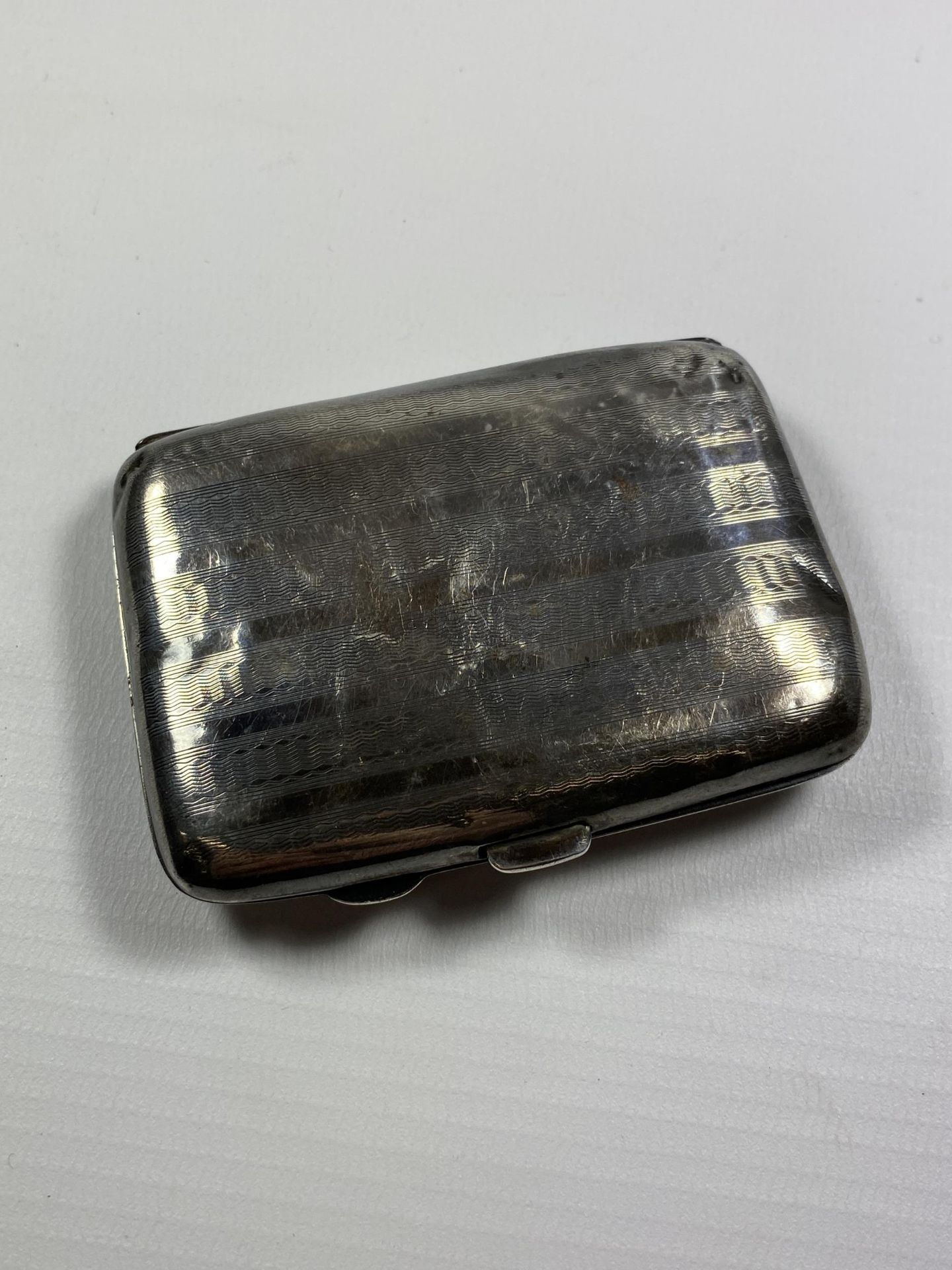 A HALLMARKED SILVER CIGARETTE CASE