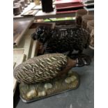 TWO CAST DOORSTOPS, ONE BEING A VINTAGE SHEEP, THE OTHER A HEDGEHOG