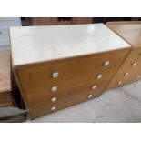 A 1960'S OAK CHEST OF FOUR DRAWERS WITH FORMICA TOP BY WILKINSONS BFD LTD, 36" WIDE