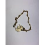 A YELLOW METAL 1/2 ALBERT CHAIN