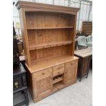 A MODERN PINE DRESSER WITH PLATE RACK, 52" WIDE