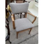 A RETRO BEECH ELBOW CHAIR STAMPED 'MAPLE'