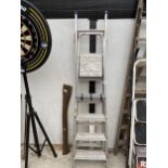 A FOUR RUNG ALUMINIUM STEP LADDER AND AN ABRU THREE WAY LADDER