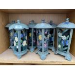 SIX DECORATIVE CAST IRON CANDLE LANTERNS WITH FLORAL AND BIRD DESIGN