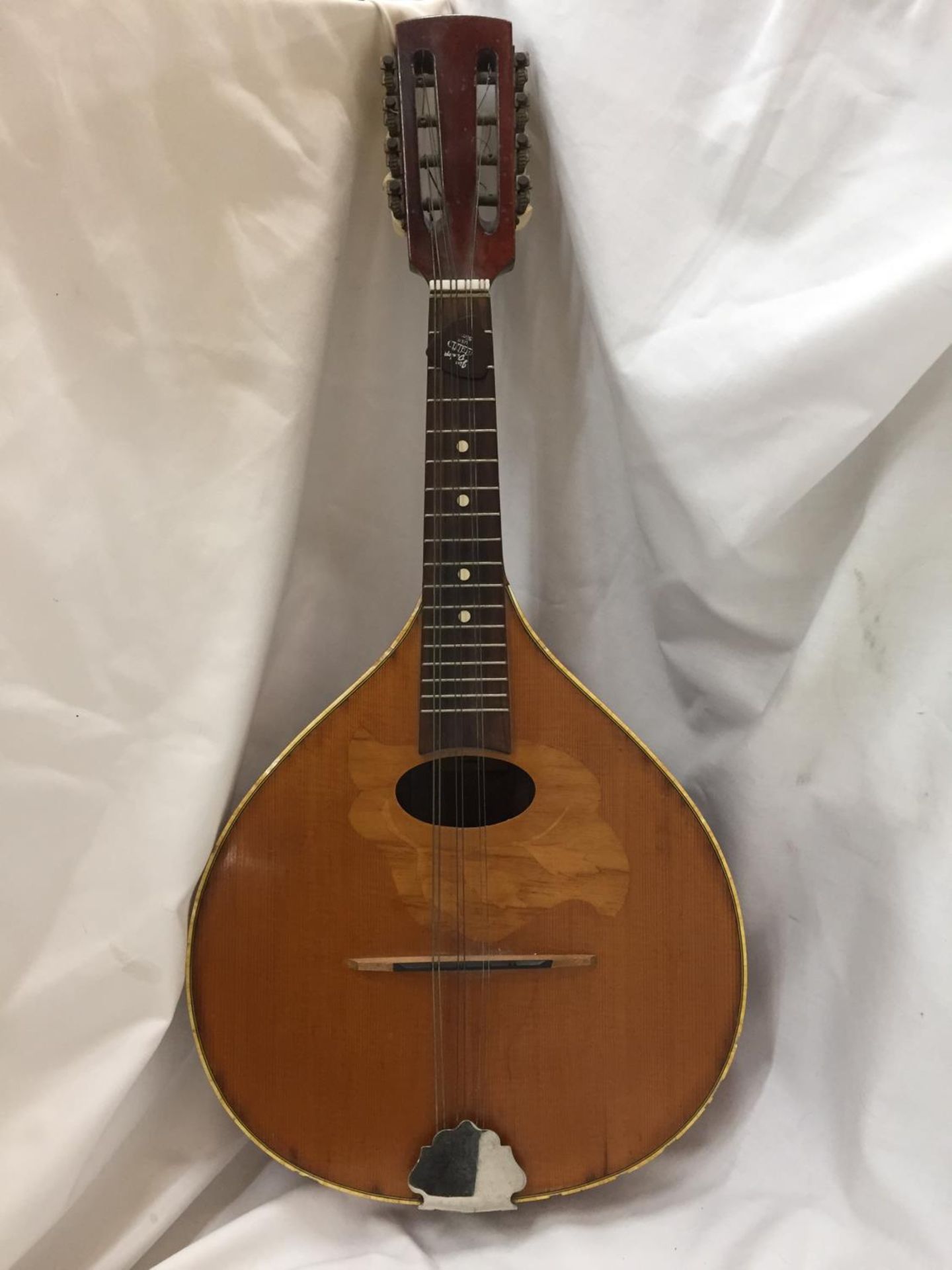 A VINTAGE INLAID MANDOLIN WITH A PLECTRUM