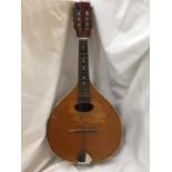 A VINTAGE INLAID MANDOLIN WITH A PLECTRUM